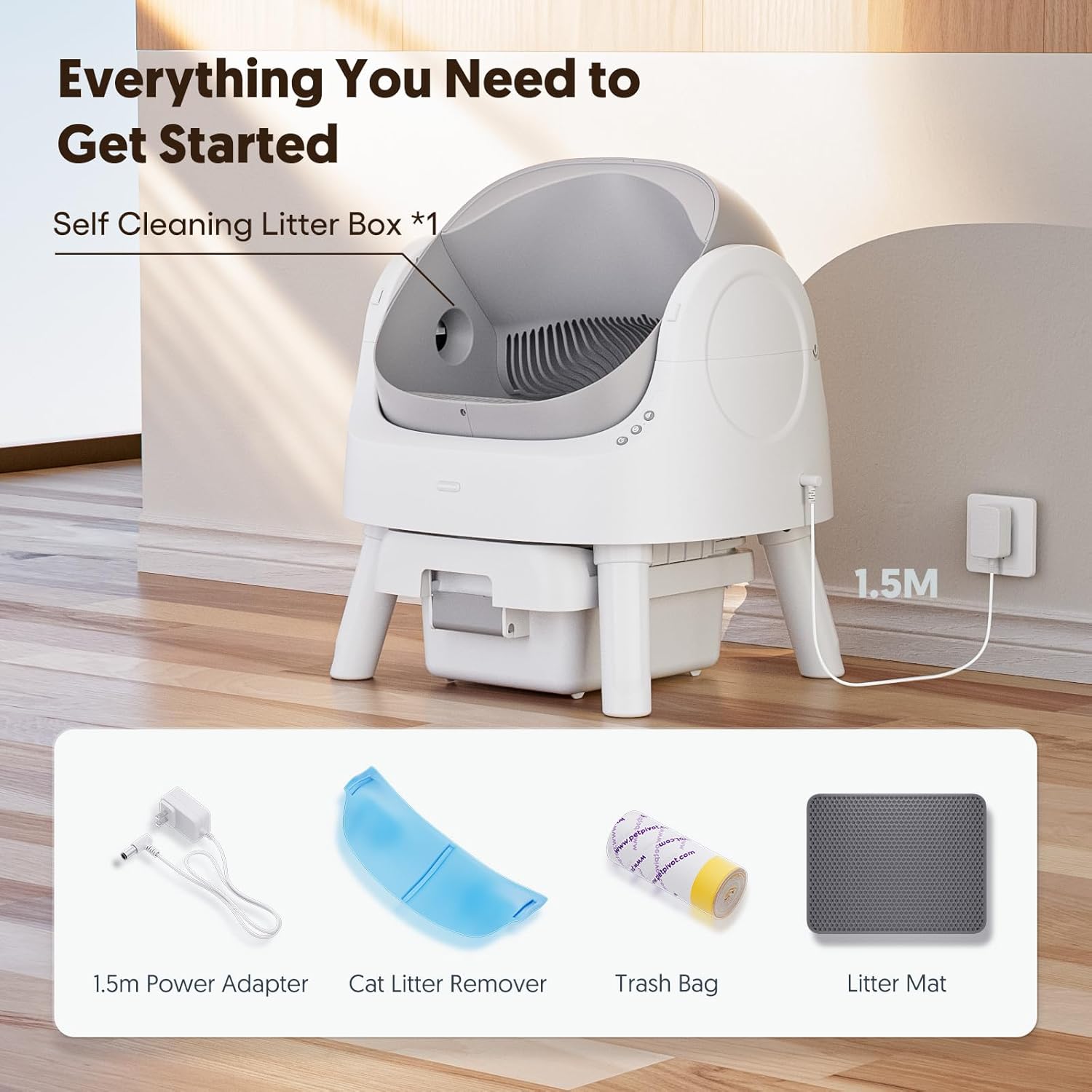 Self cleaning litter box with accessories on a wooden floor